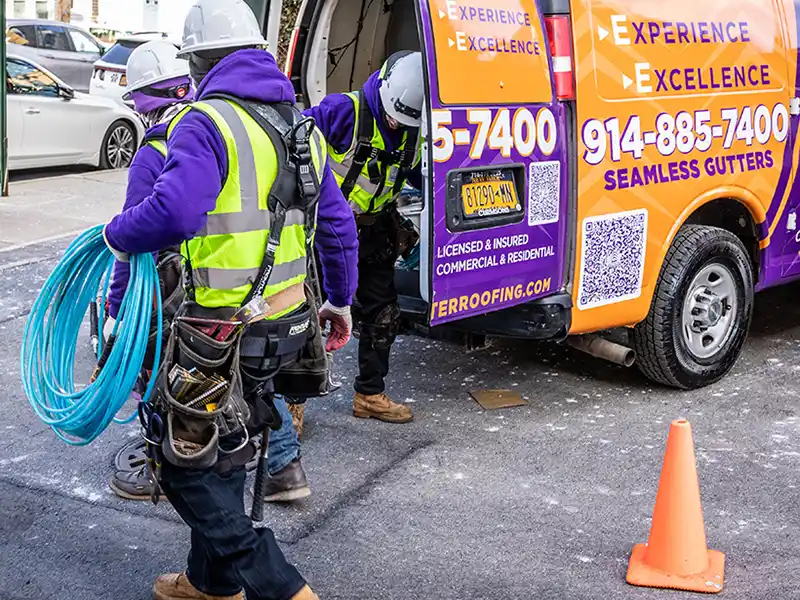 Crew getting equipment from truck